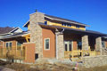 Stucco - Diamond Back with Window & Door Trim | Stone - Manufacture | Stone Caps - Natural Stone